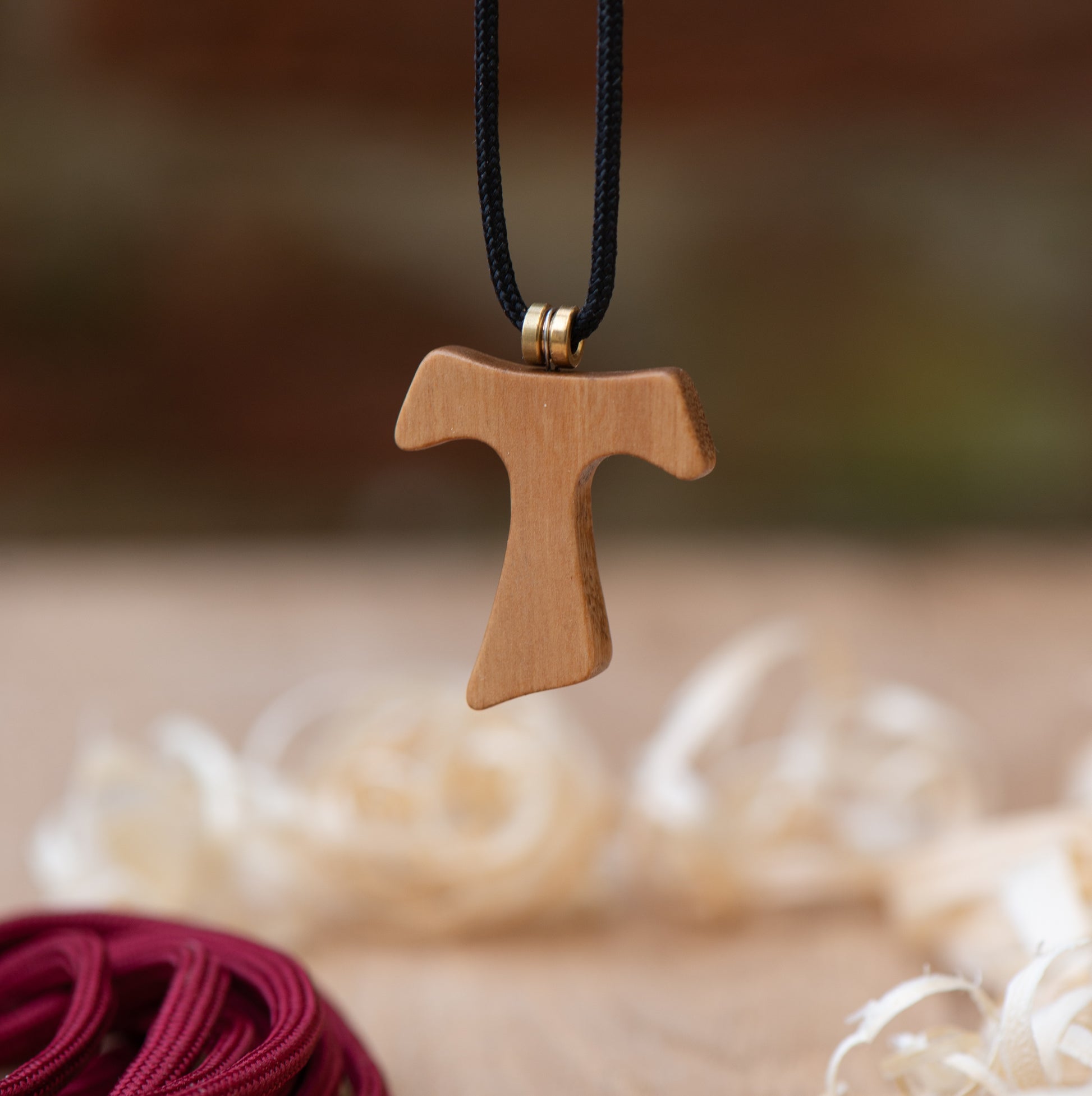 Tau cross pendant in olive wood with bass guitar string ball-end and paracord necklace – Dogstar Wood Lab