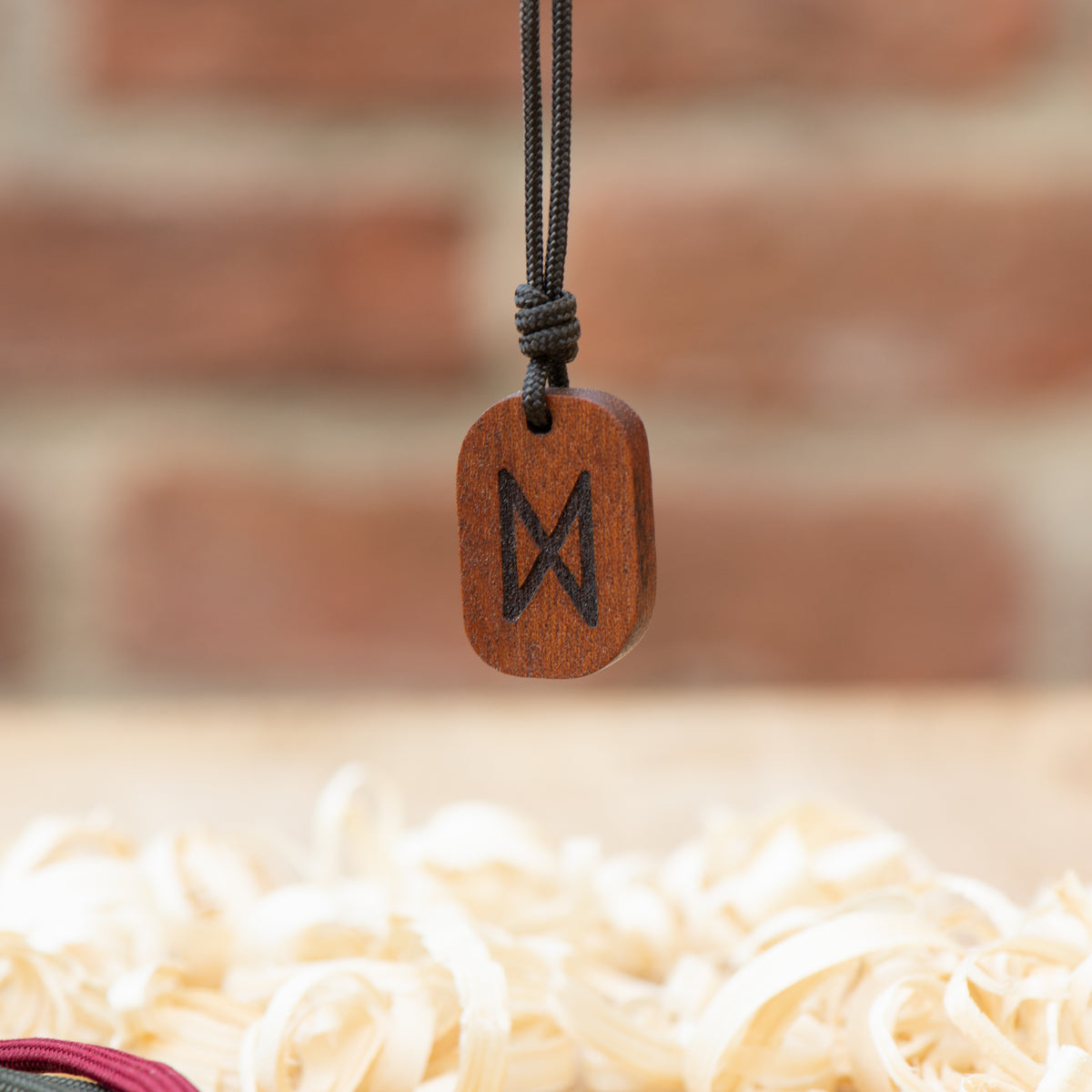 dagaz rune pendant in mahogany wood celtic amulet handmae