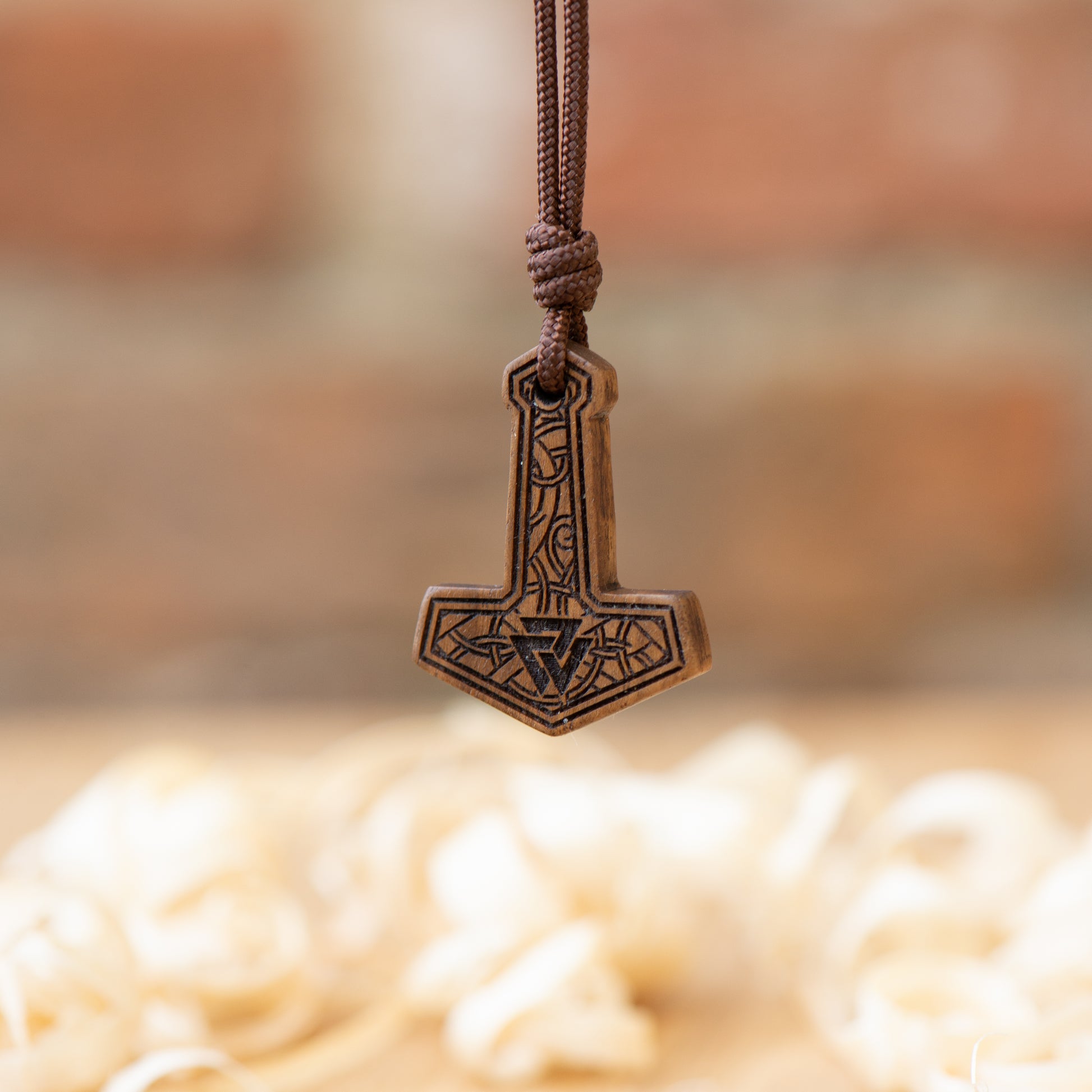 handmade-Mjölnir-pendant-in-walnut-wood
