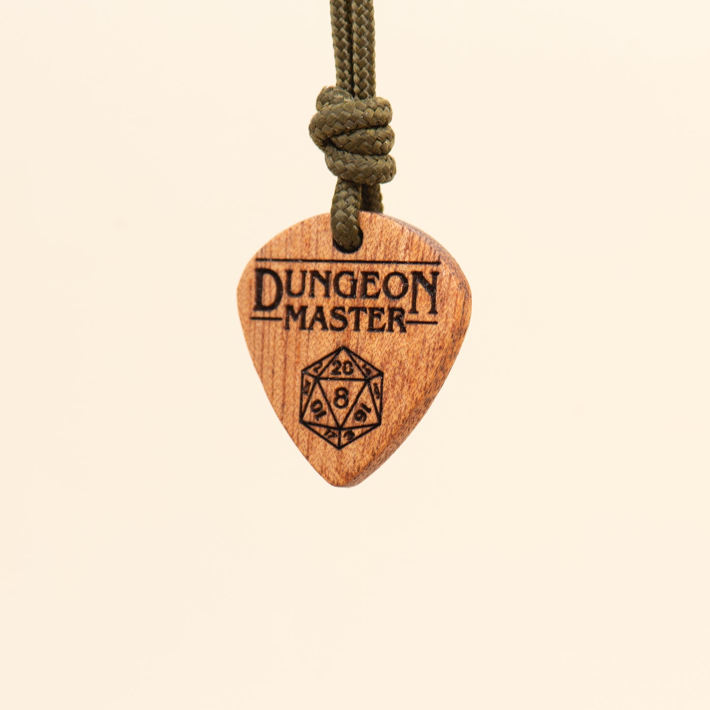 Right side view of an artisan Dungeon Master pendant inspired by tabletop RPGs